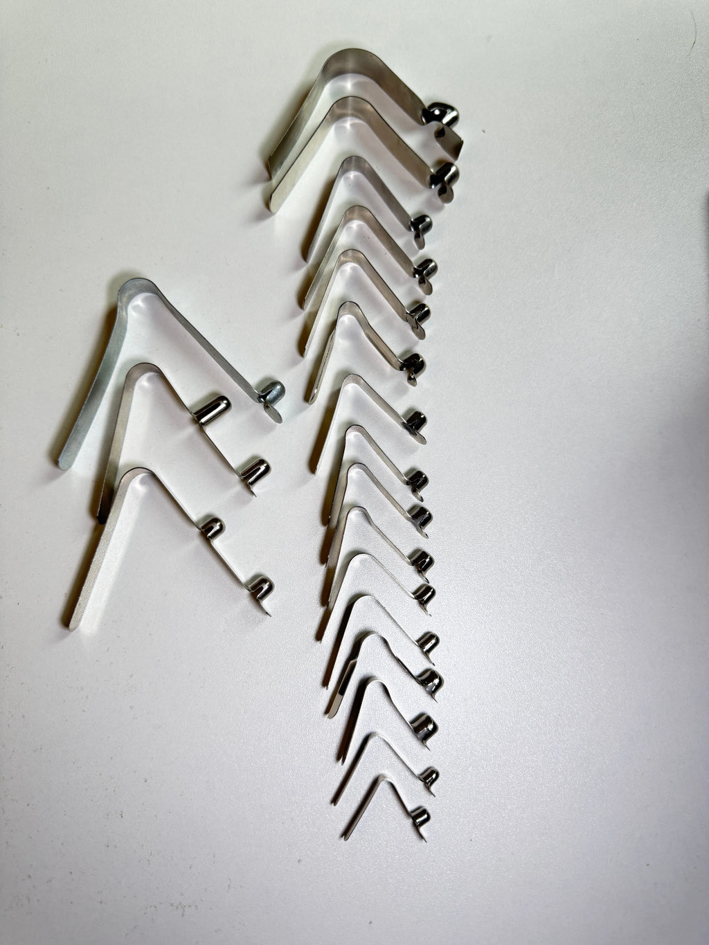 Custom Single-Head Spring Clip - full size range showcase, single and double button variants